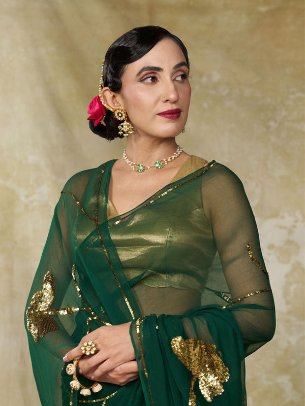Emerald green pure chiffon saree with hand embroidered gold sequin roses by MAYIN