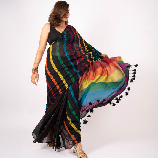 Woman wearing a colorful saree with black border on a white background