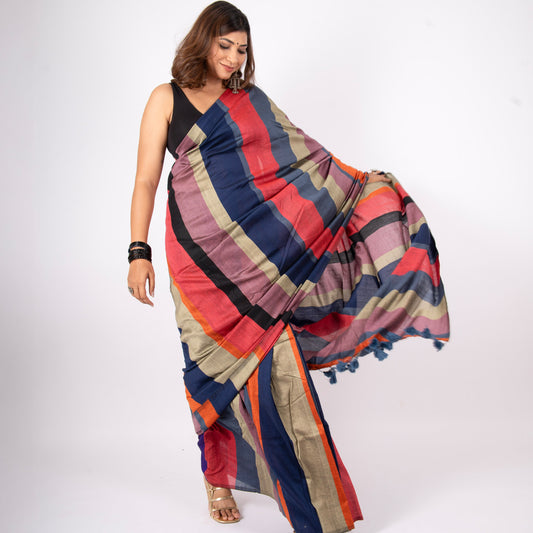Woman wearing a colorful striped saree on a white background