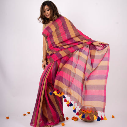 Woman wearing a colorful striped saree with a white background