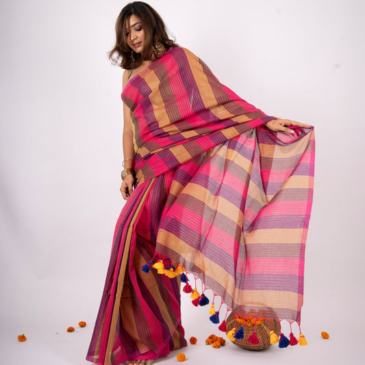 Woman wearing a colorful striped saree with a white background