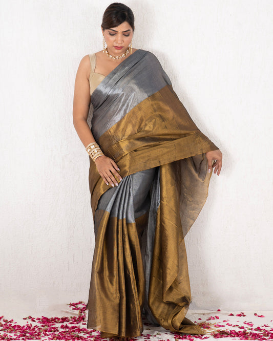 Woman wearing a traditional saree with a gradient design on a white background
