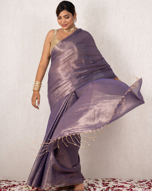 Woman in a purple saree with a white background